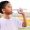 65435951 - young asian boy drinking fresh water from plastic bottle after sport in stadium.