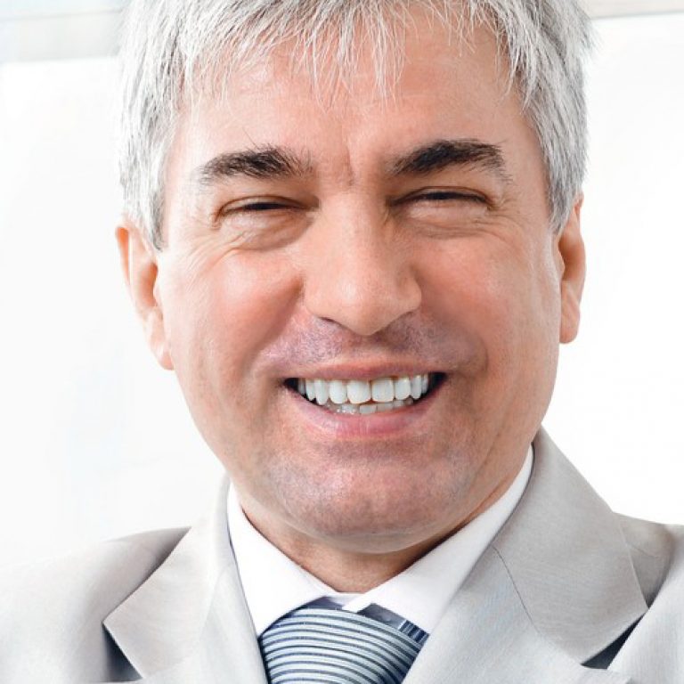 older-businessman-with-confident-smile-1-1000x520@2x