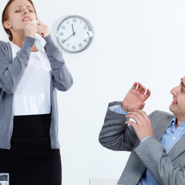 sick-businesswoman-sneezing-on-partner-1-1000x520